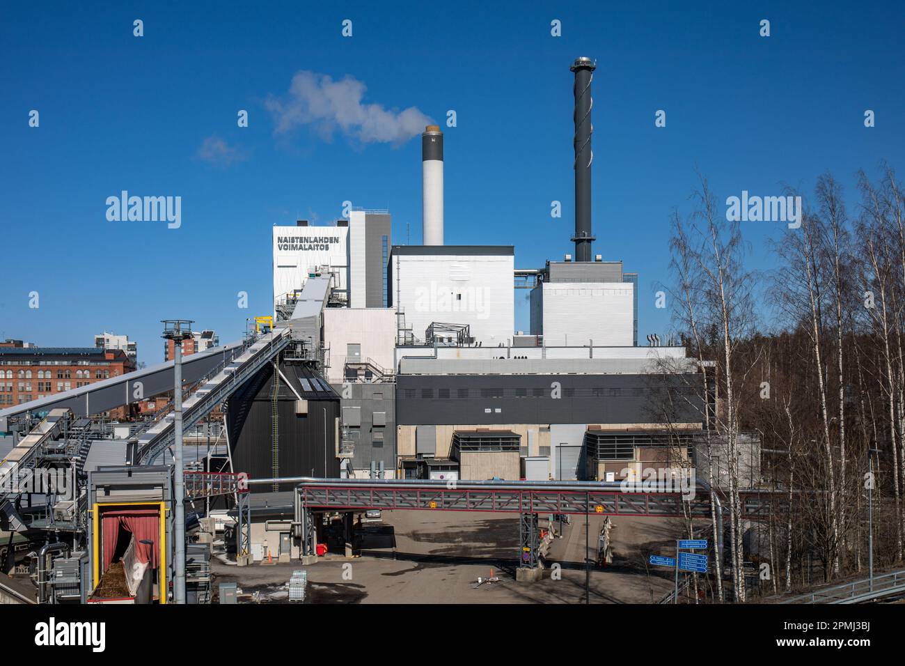 Naistenlahden voimalaitos or Naistenlahti Power Plant against clear blue sky on a sunny spring day in Tampere, Finland Stock Photo