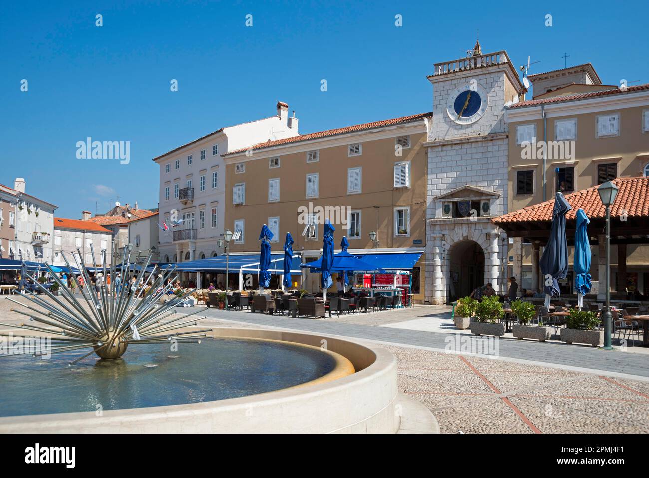 Fountain and sea gate, Trg Petrica square, Cres Town, Cres Island, Kvarner Gulf Bay, Croatia Stock Photo