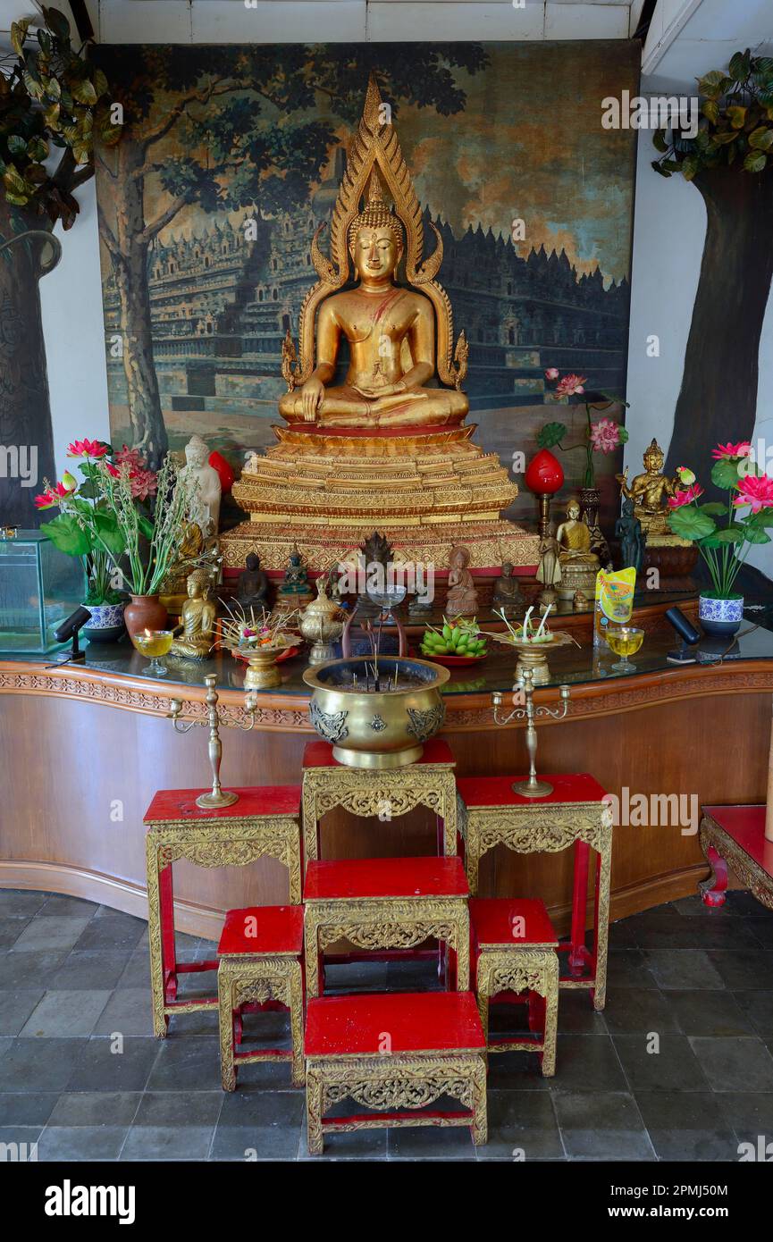 Buddha statue on an altar in a prayer room of the Buddhist monastery Brahma Vihara, Banjar, North Bali, Bali, Indonesia Stock Photo