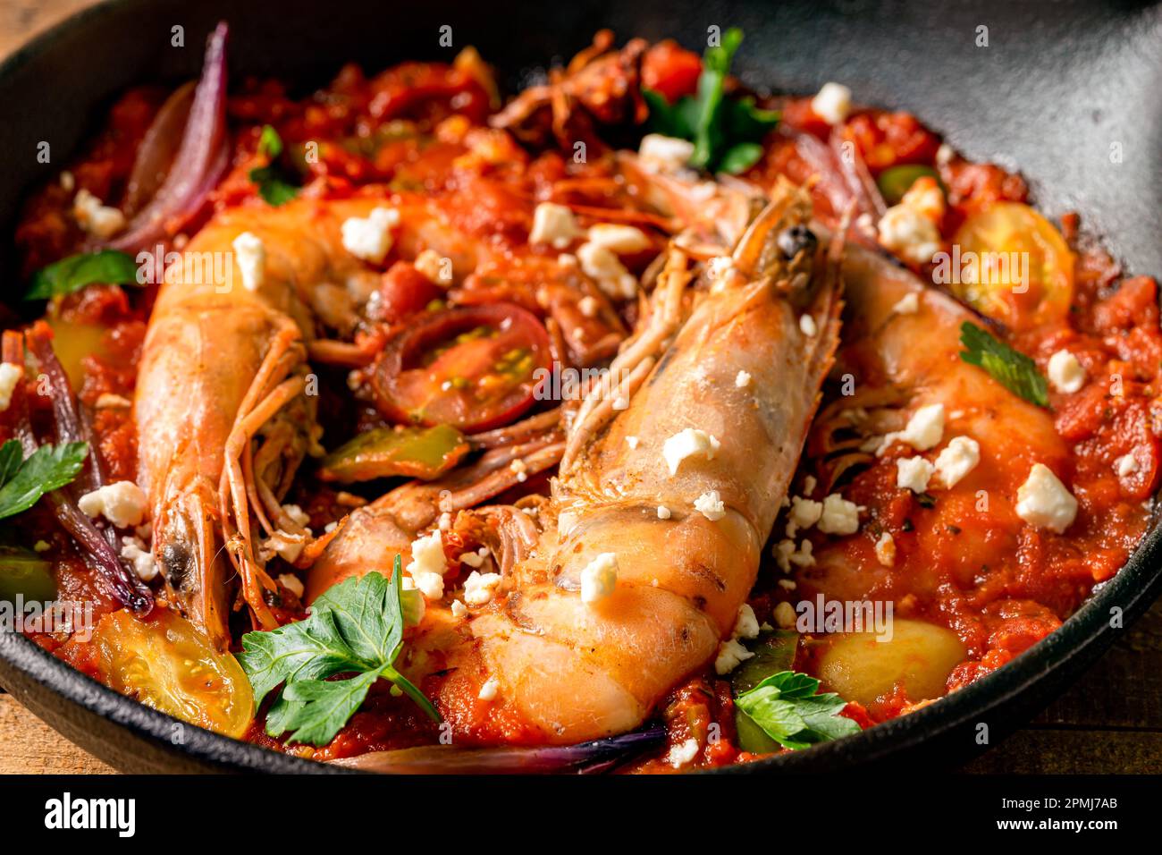 Prawns in a cast iron skillet. Close up shot. Stock Photo