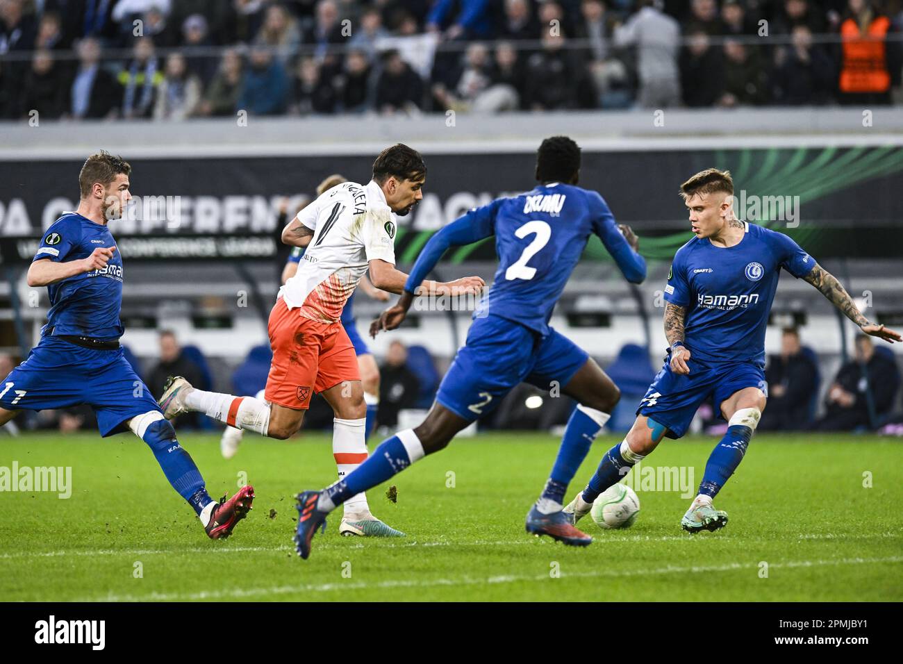 Gent, Belgium. 13th Apr, 2023. Gent's Hugo Cuypers, West Ham's Lucas  Paqueta and Gent's Kamil Piatkowski pictured in action during a soccer game  between Belgian KAA Gent and English West Ham United