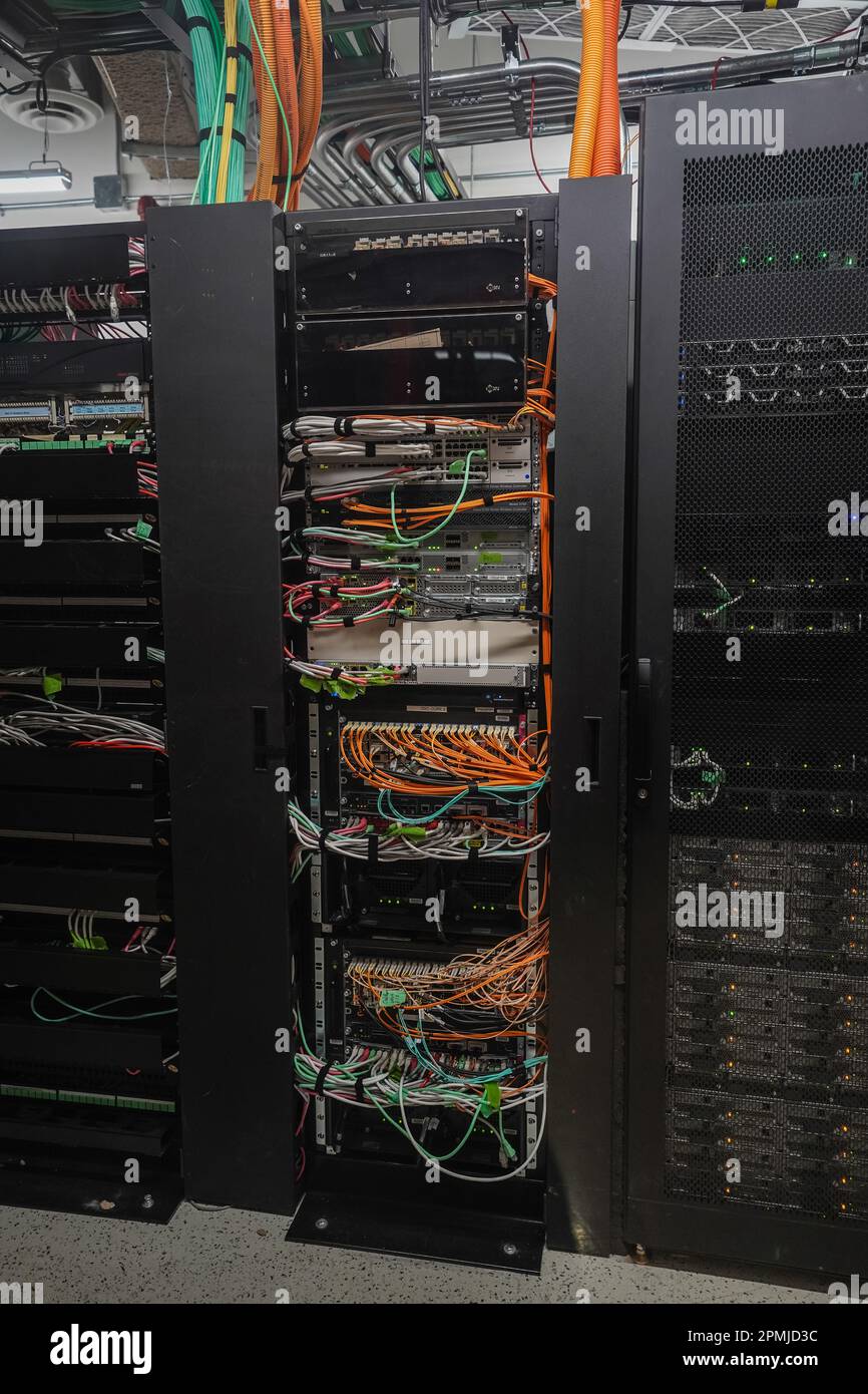 Towers of computer servers sitting in a secure data center room Stock
