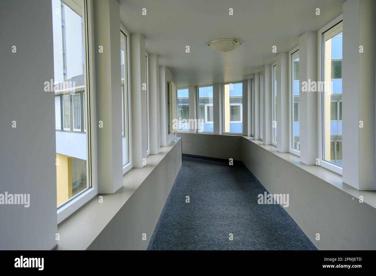 A walkway or corridor or hallway between buildings. A corridor with a