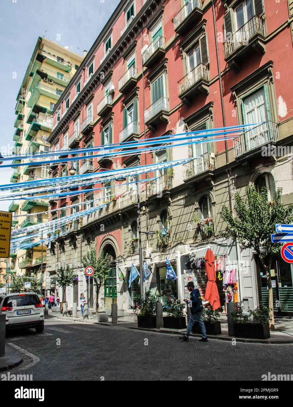 April 2, 2023, Naples, Italy:  Celebratory blue and white bunting and streamers marking the success of the S.S.C. Napoli football team.  Via Duomo, Ce Stock Photo