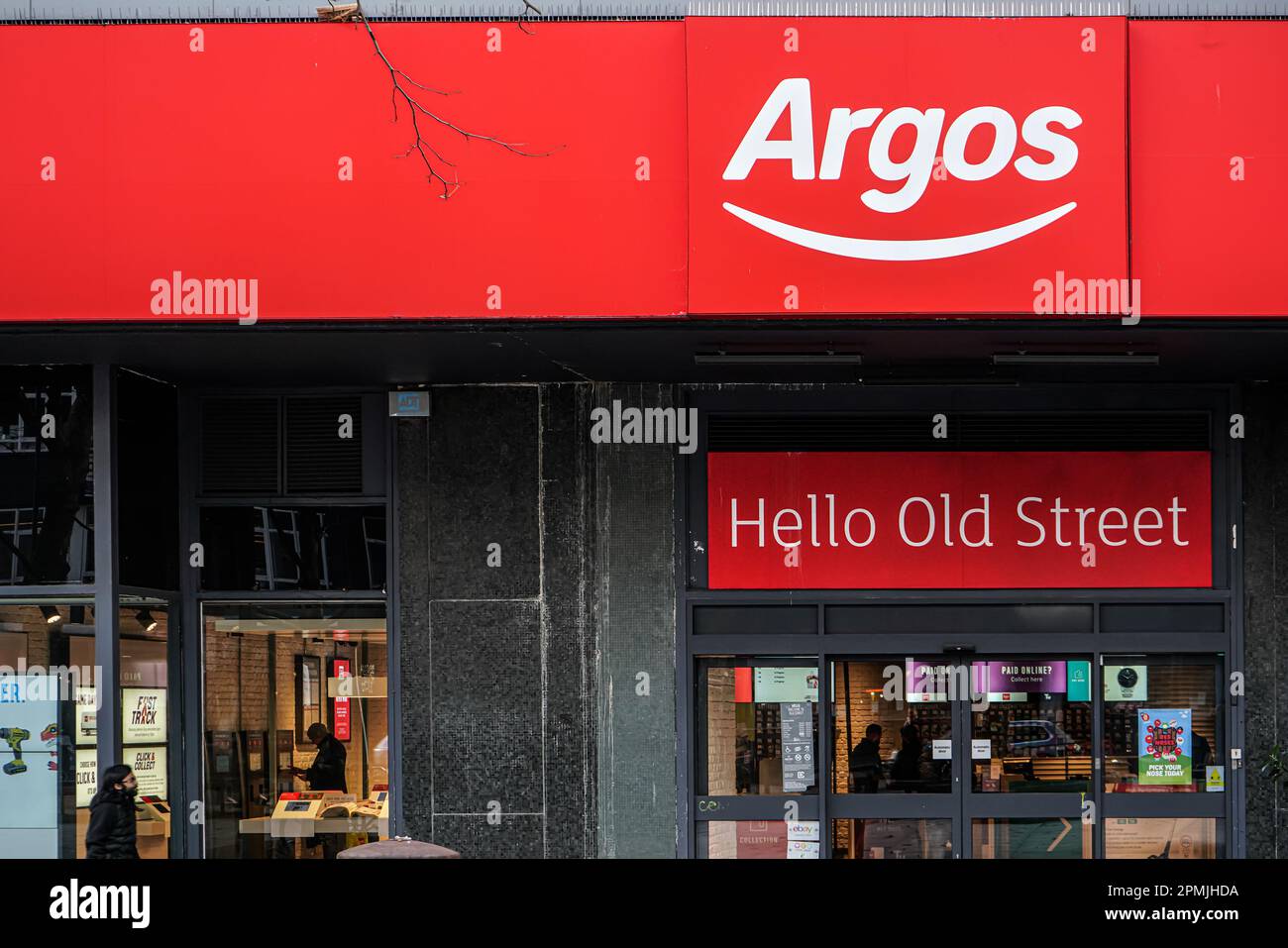 London, United Kingdom - February 02, 2019: White and red Argos logo at entrance to one of their branches in Old Street. It is largest catalogue retai Stock Photo