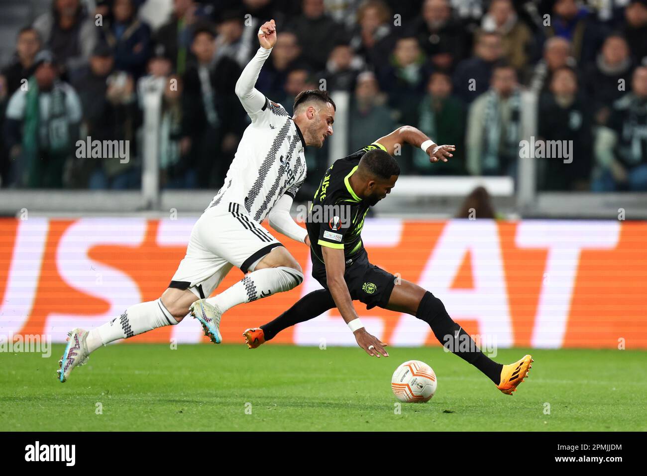 Turin, Italy. 13th Apr, 2023. Sebastian Coates of Sporting Clube de Portugal and Filip Kostic of Juventus Fc battle for the ball during the Uefa Europa League quarter-final first leg match beetween Juventus Fc and Sporting Clube de Portugal at Allianz Stadium on April 13 2023 in Turin, Italy . Credit: Marco Canoniero/Alamy Live News Stock Photo
