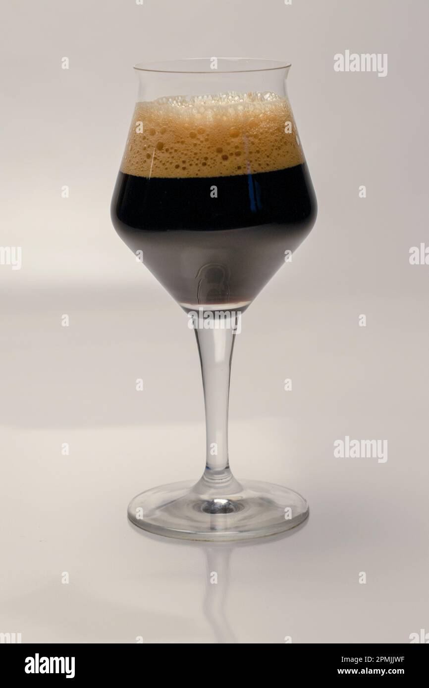 Porter. A type of dark beer with a higher alcohol content of approx. 8%. In a drinking glass of beer. Stock Photo
