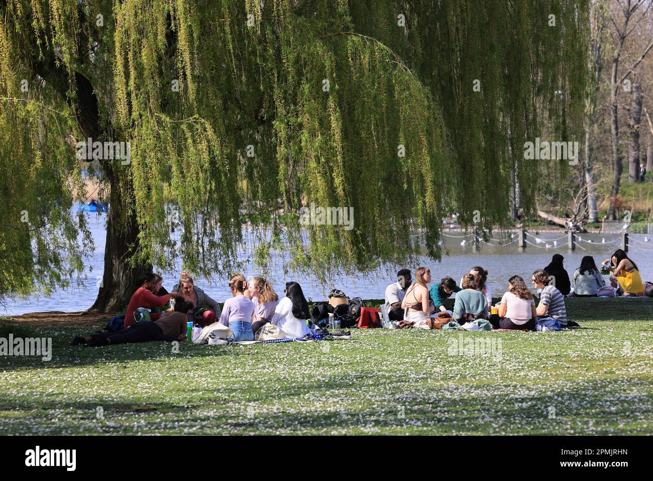 Easter Sunday 2023 in Regents Park, London, crowds enjoy the spring weather by the lake, UK Stock Photo