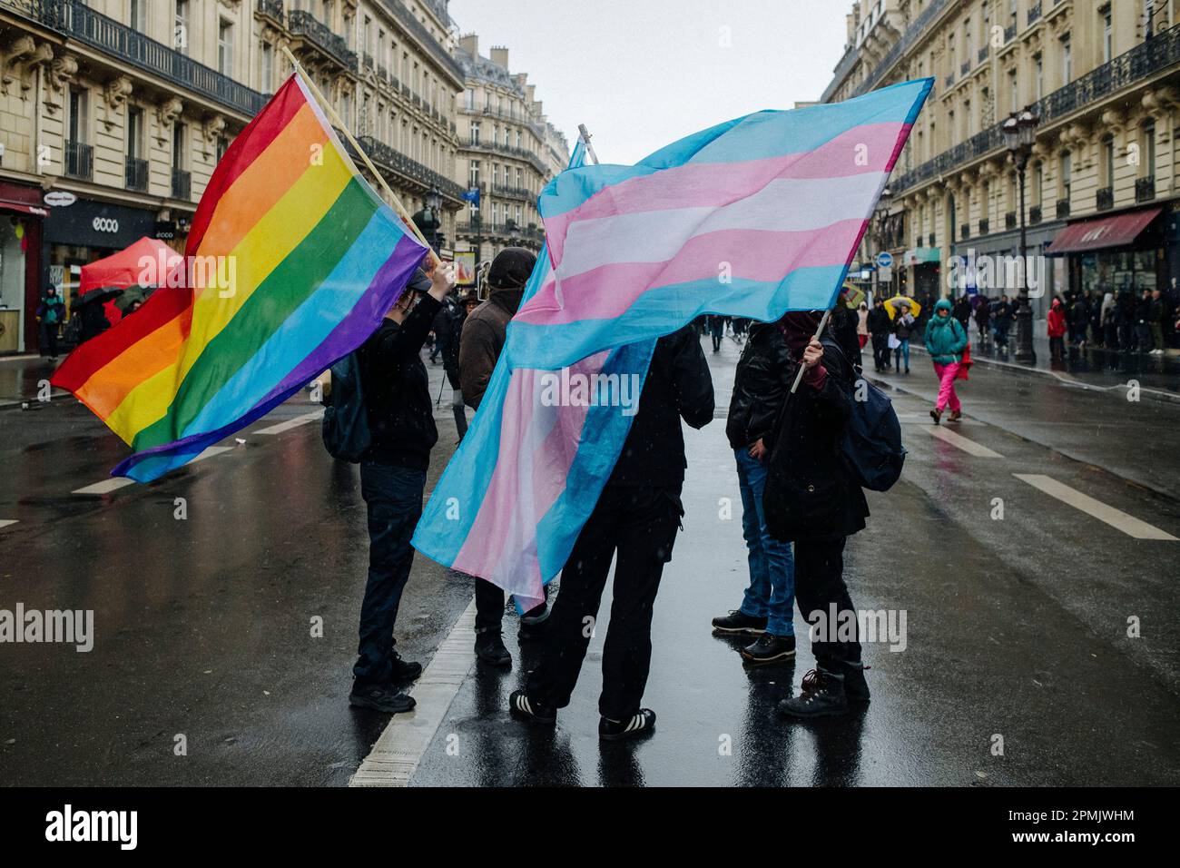 Jan Schmidt-Whitley/Le Pictorium -  Demonstration against pension reform in Paris  -  13/4/2023  -  France / Paris / Paris  -  A group with LGBT+ and Trans flags. The participation was again in decline this Thursday for the twelfth day of mobilization against the pension reform, the figures of the unions as those of the authorities approaching their lowest levels since the beginning of the social movement. In the capital, the police headquarters counted 42,000 demonstrators (compared to 57,000 on 6 April) while the CGT claimed 400,000. Stock Photo