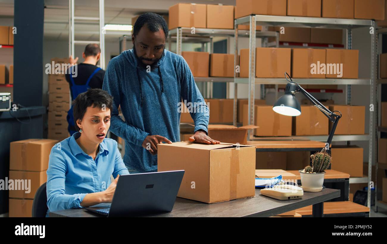 Diverse people working on shipping merchandise to customers, planning delivery and shipment