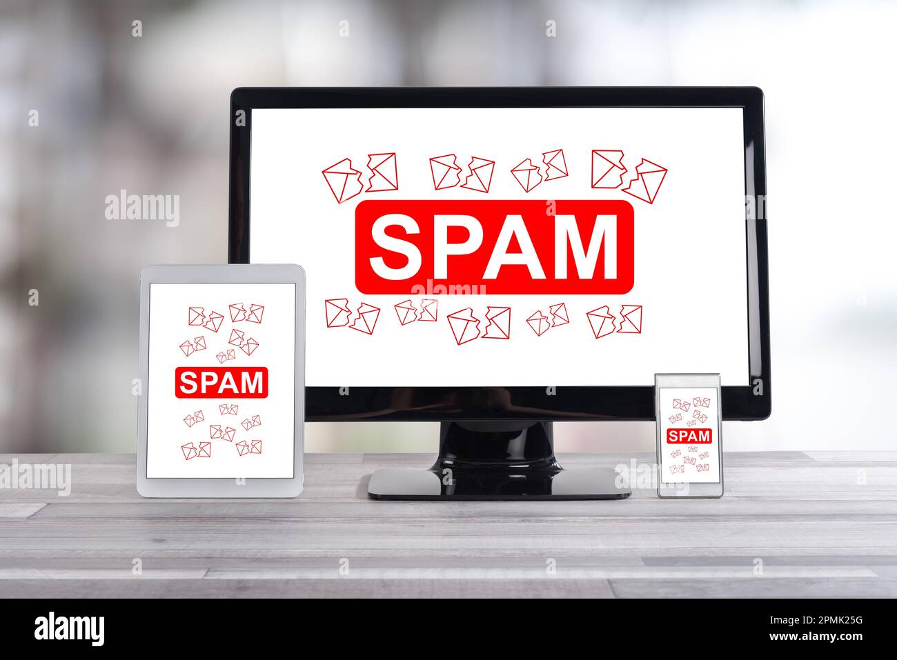 Spam concept shown on different information technology devices Stock Photo