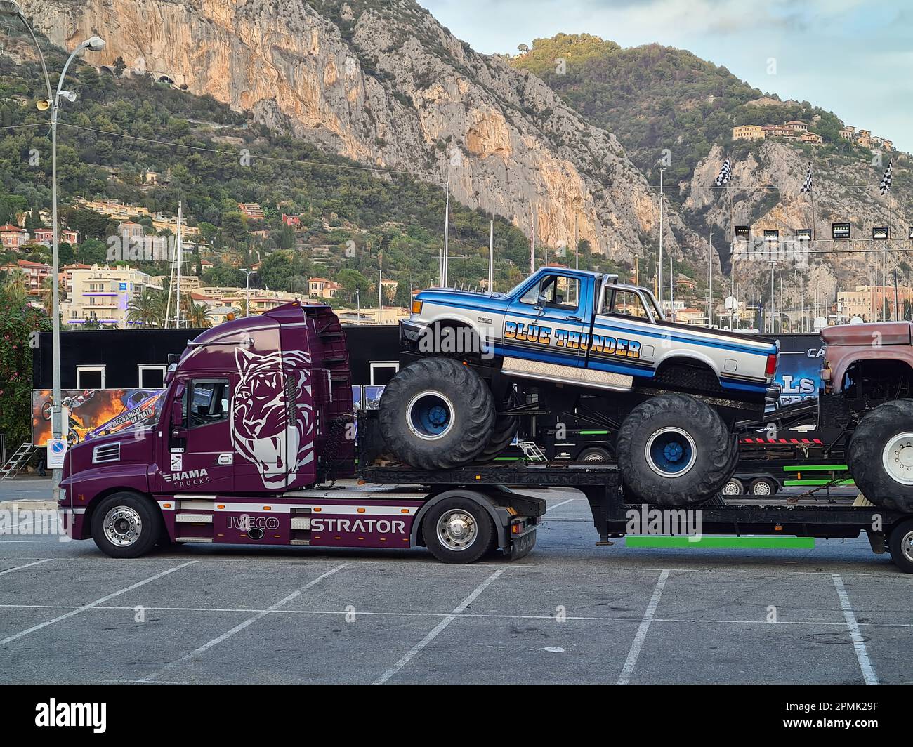 Two Drivers One Wheel Menton, France, 2 October 2022: An Iveco semi-truck hauling two massive ...