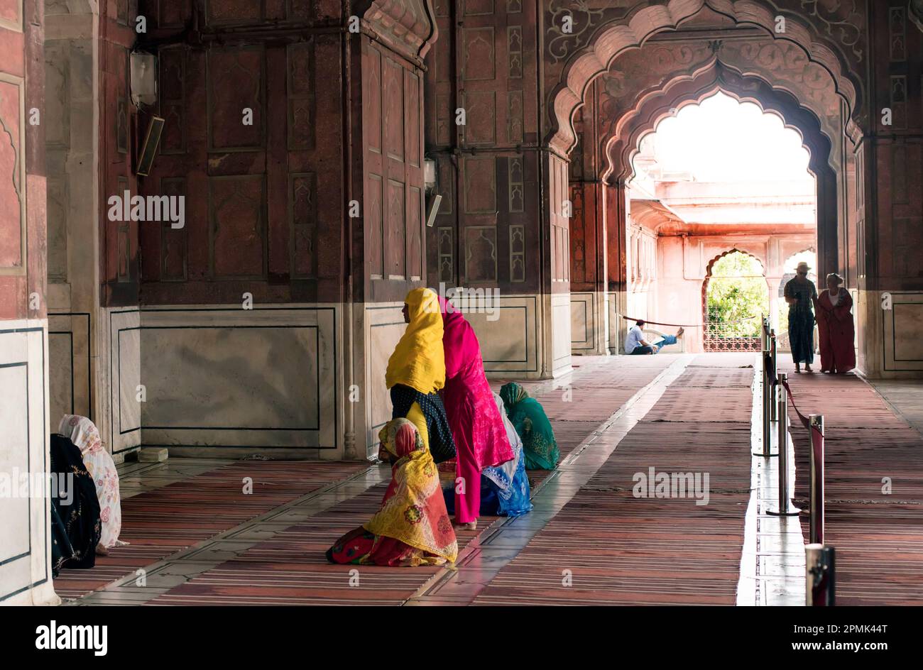 Muslim women praying at the Jana Masjid Mosque, Delhi, India Stock Photo