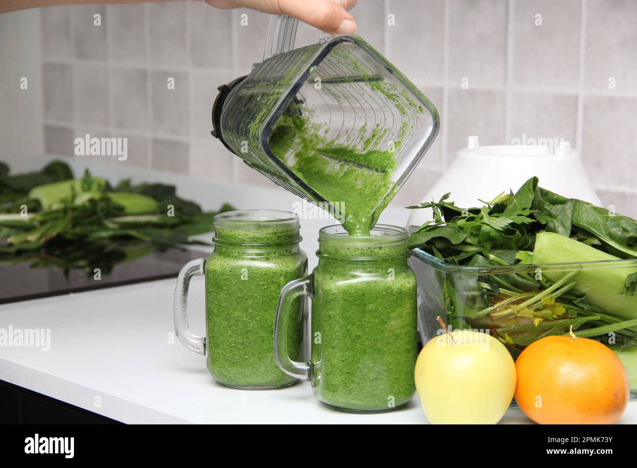 https://c8.alamy.com/comp/2PMK73Y/serve-green-juice-in-mason-jar-just-made-in-kitchen-blender-with-ingredients-like-cucumber-chard-spinach-celery-for-a-nutritious-breakfast-2PMK73Y.jpg