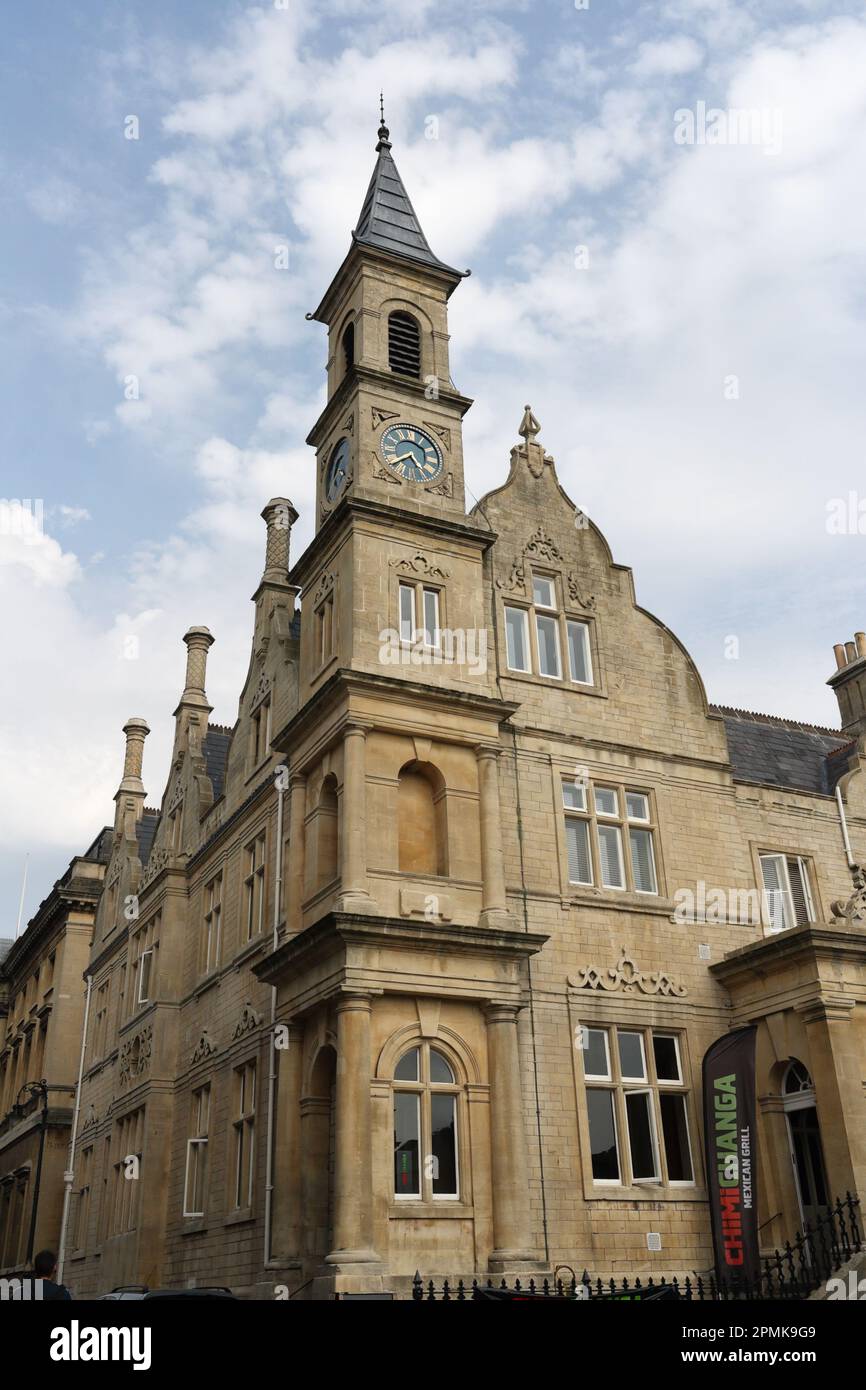 Clock tower, Bluecoat house, Saw close, Bath city centre, England UK. Grade II listed building, Victorian public building Stock Photo