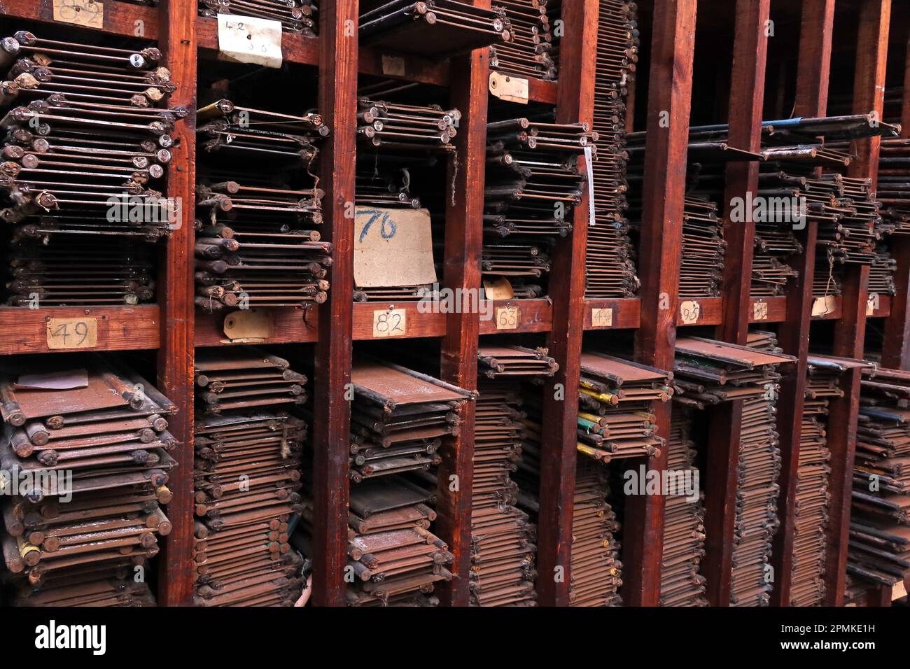 Weaving loom reeds of different lengths, stored in shelves, Cotton weaving mill, Burnley, Lancashire, England, UK, Stock Photo