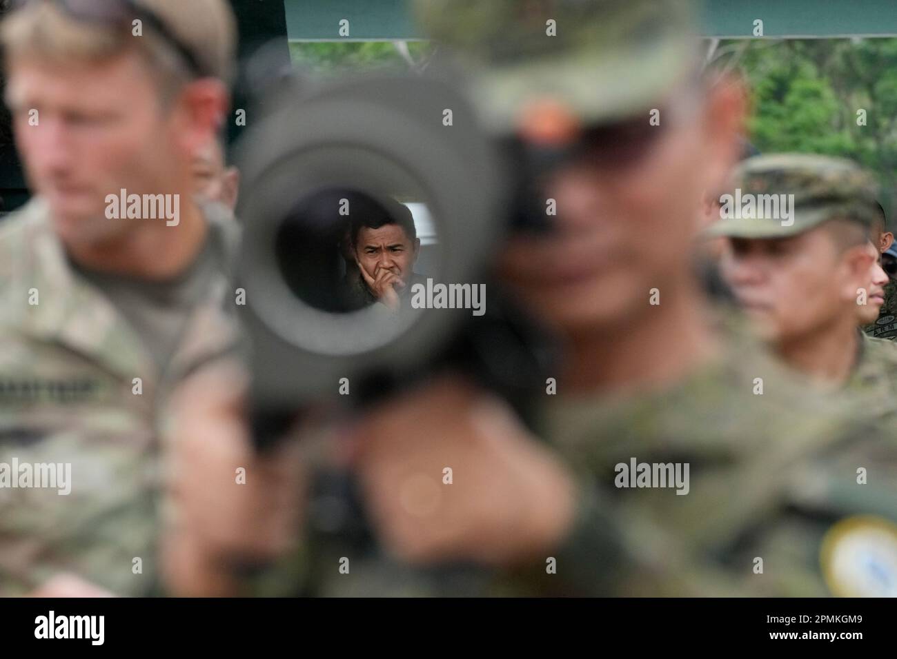 A Filipino soldier is seen through the barrel of a Carl Gustaf