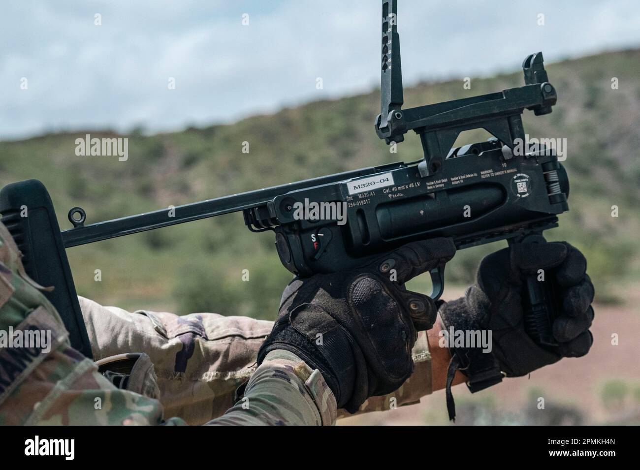 U.S. Army soldiers assigned to Task Force Wolfhound fires a 320 grenade launcher at Arta Range, Djibouti, March 30, 2023. As the United States’ largest tactical unit on the continent of Africa, TFWH makes up more than two-thirds of the CJTF-HOA force and is critical to providing security and building partnerships throughout East Africa in support of U.S. Africa Command.(U.S. Air Force photo by Staff Sgt. Aaron Irvin) Stock Photo