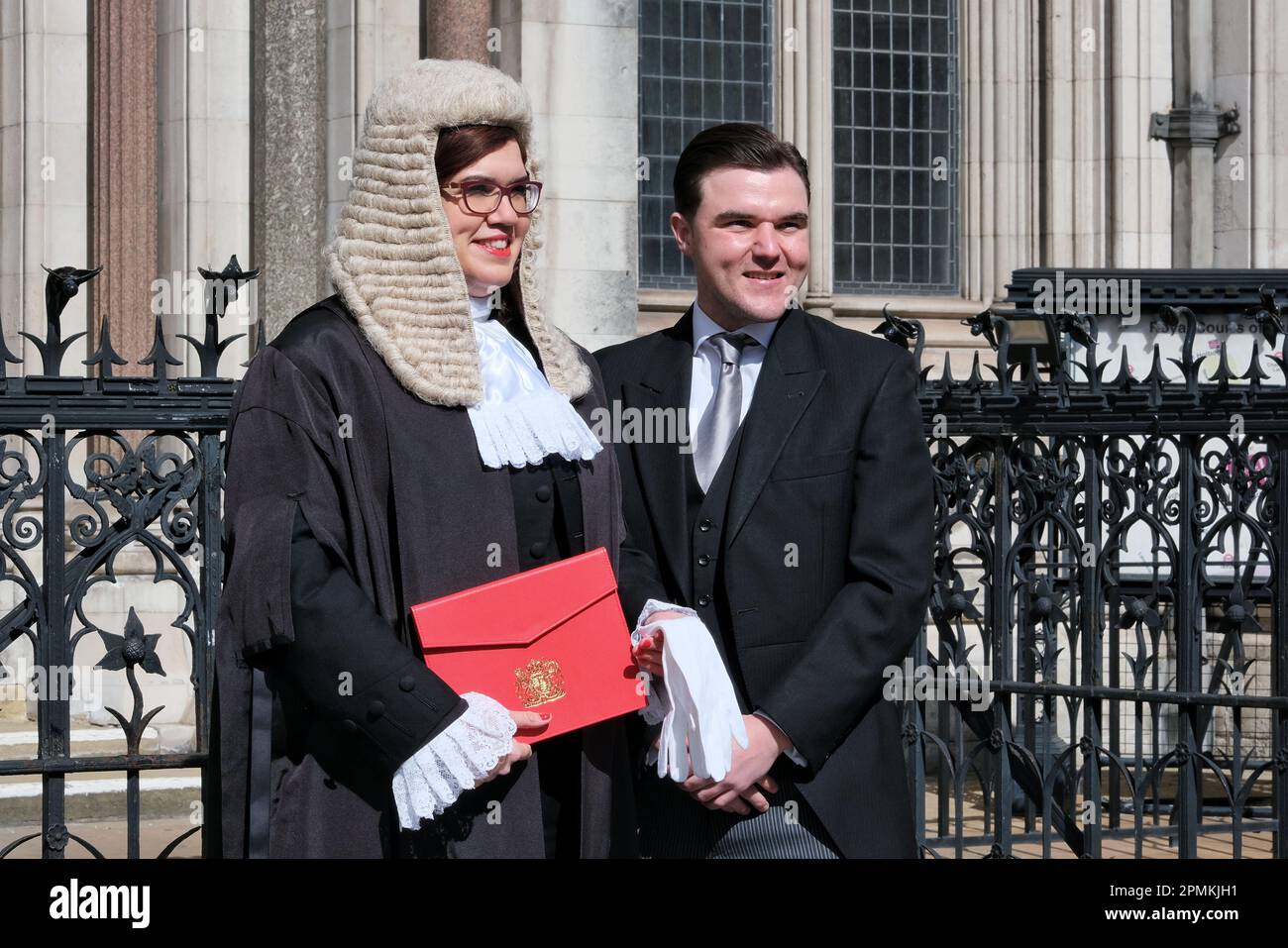 A newly swornin member of the King's Counsel poses in court attire