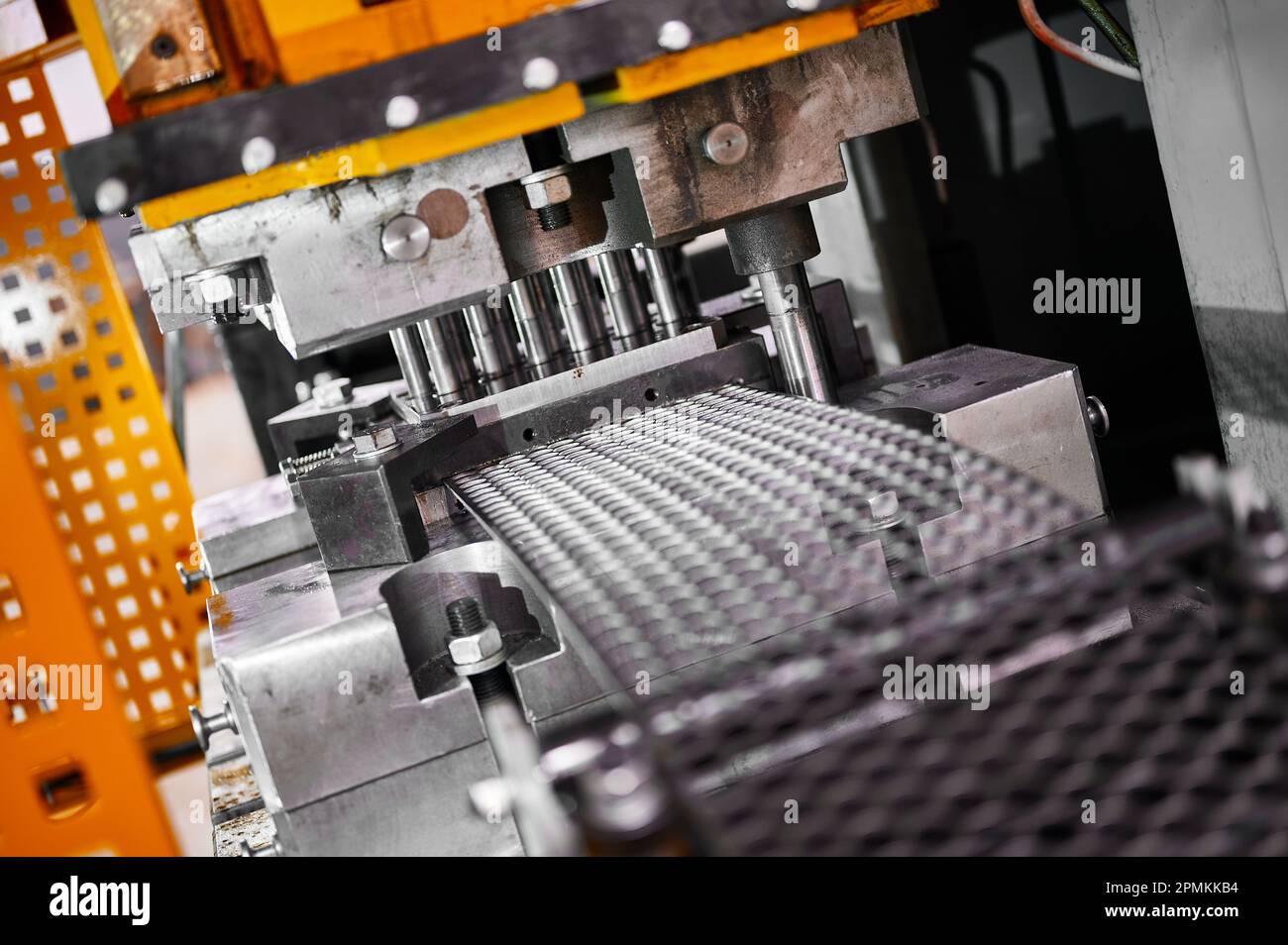 Cutting of steel blanks from metal strip on stamping press Stock Photo Alamy