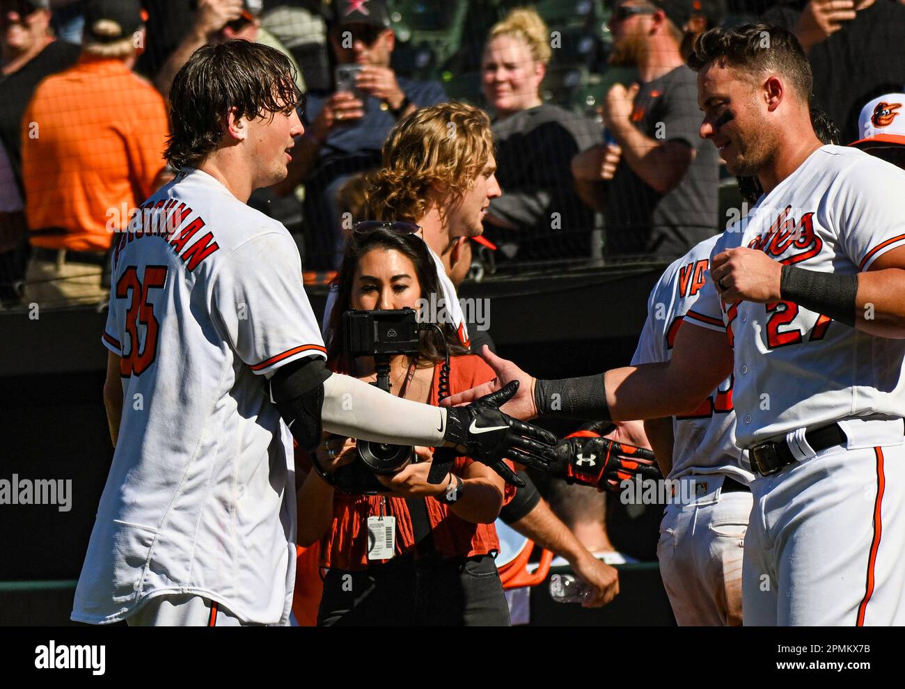 BALTIMORE, MD - APRIL 13: Baltimore Orioles right fielder Terrin Vavra (23)  congratulates catcher Adley Rutschman (35) after his walk off home run  during the Oakland Athletics versus the Baltimore Orioles on