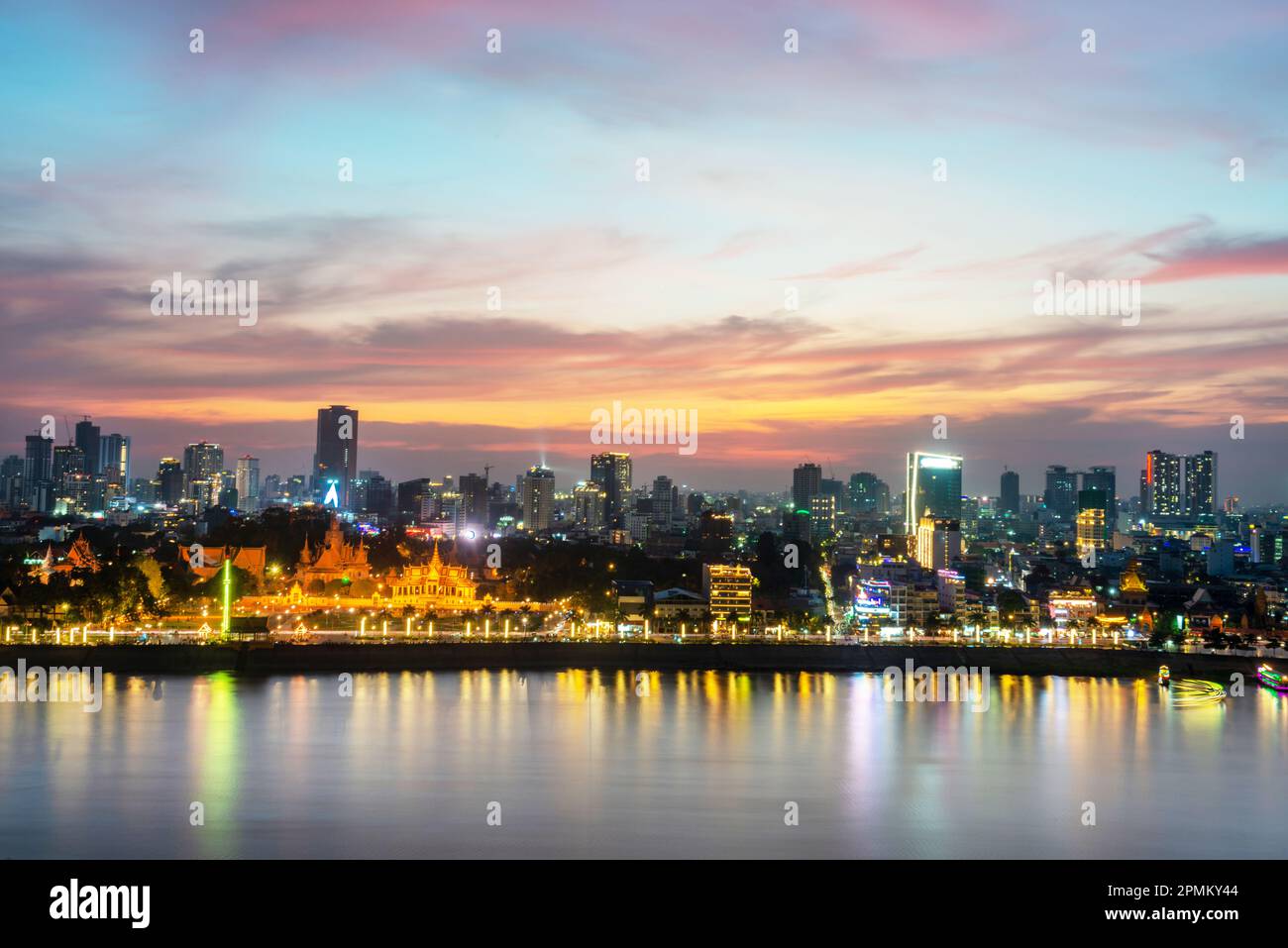 The golden afterglow over Cambodia's capital city,it's busy Riverside ...