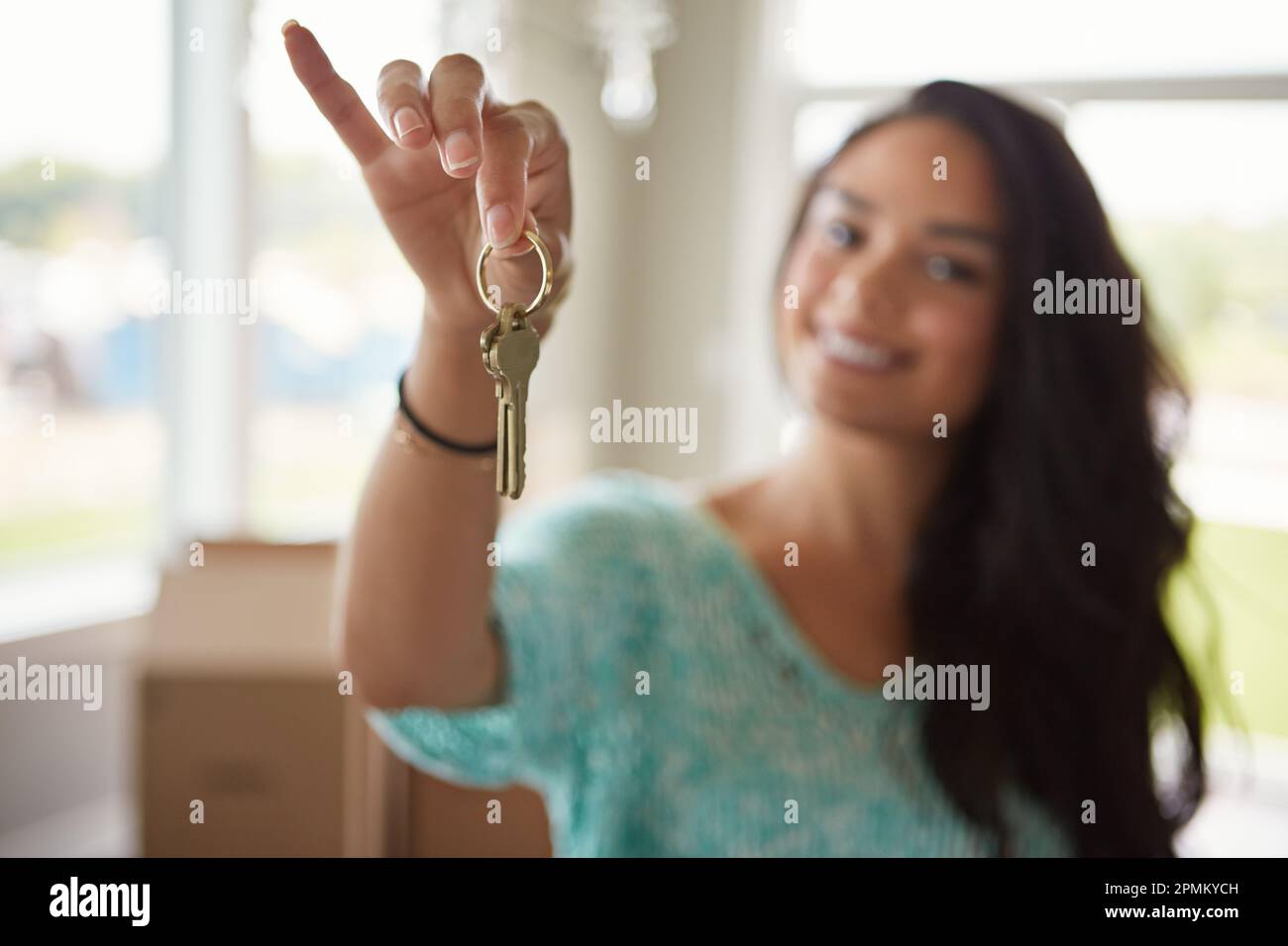 The keys to her new home. a woman moving into her new home Stock Photo ...