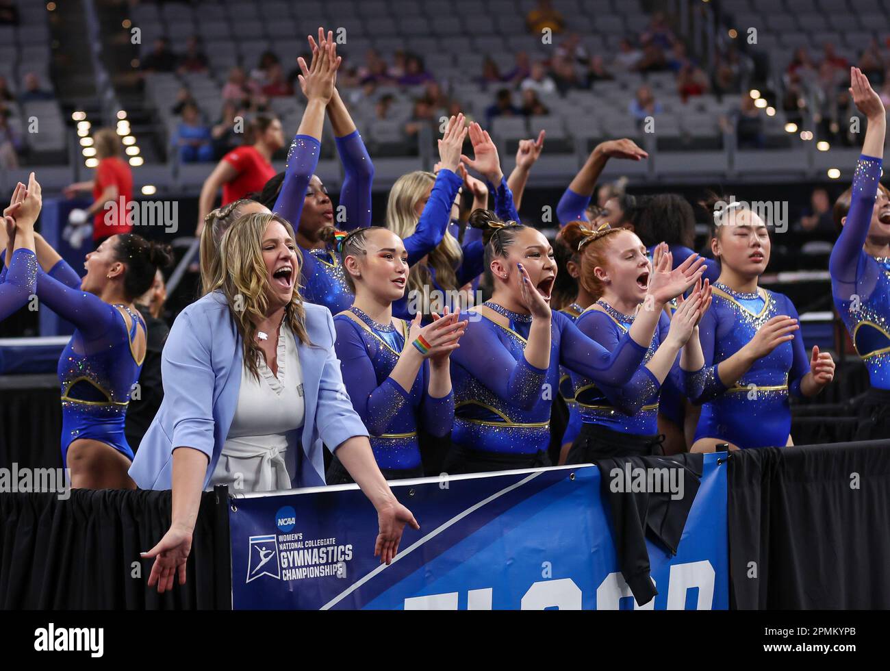 April 13, 2023 The UCLA gymnastics team cheers following Jordan Chiles