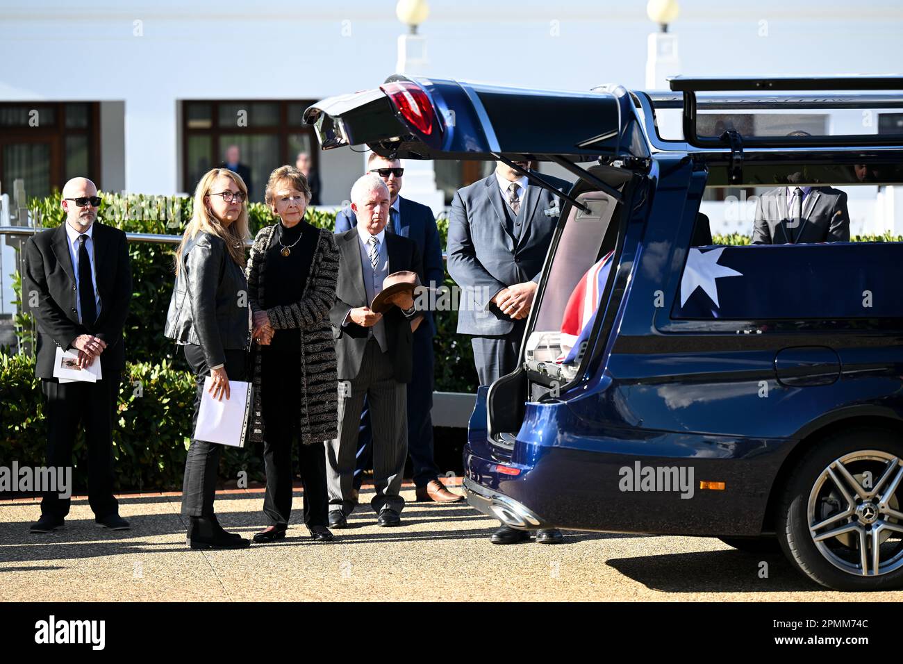 Wife June Verrier and daughter Heidi Williams react during the state