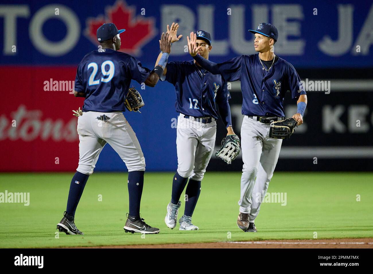 Tampa Tarpons Alan Mejia (12) talks with manager Rachel Balkovec (2) during  an MiLB Florida State League baseball game against the Lakeland Flying  Tigers on April 9, 2023 at George M. Steinbrenner