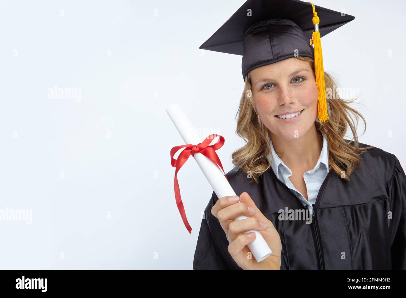Graduated D Proud to have graduated. Attractive young woman holding a university ...