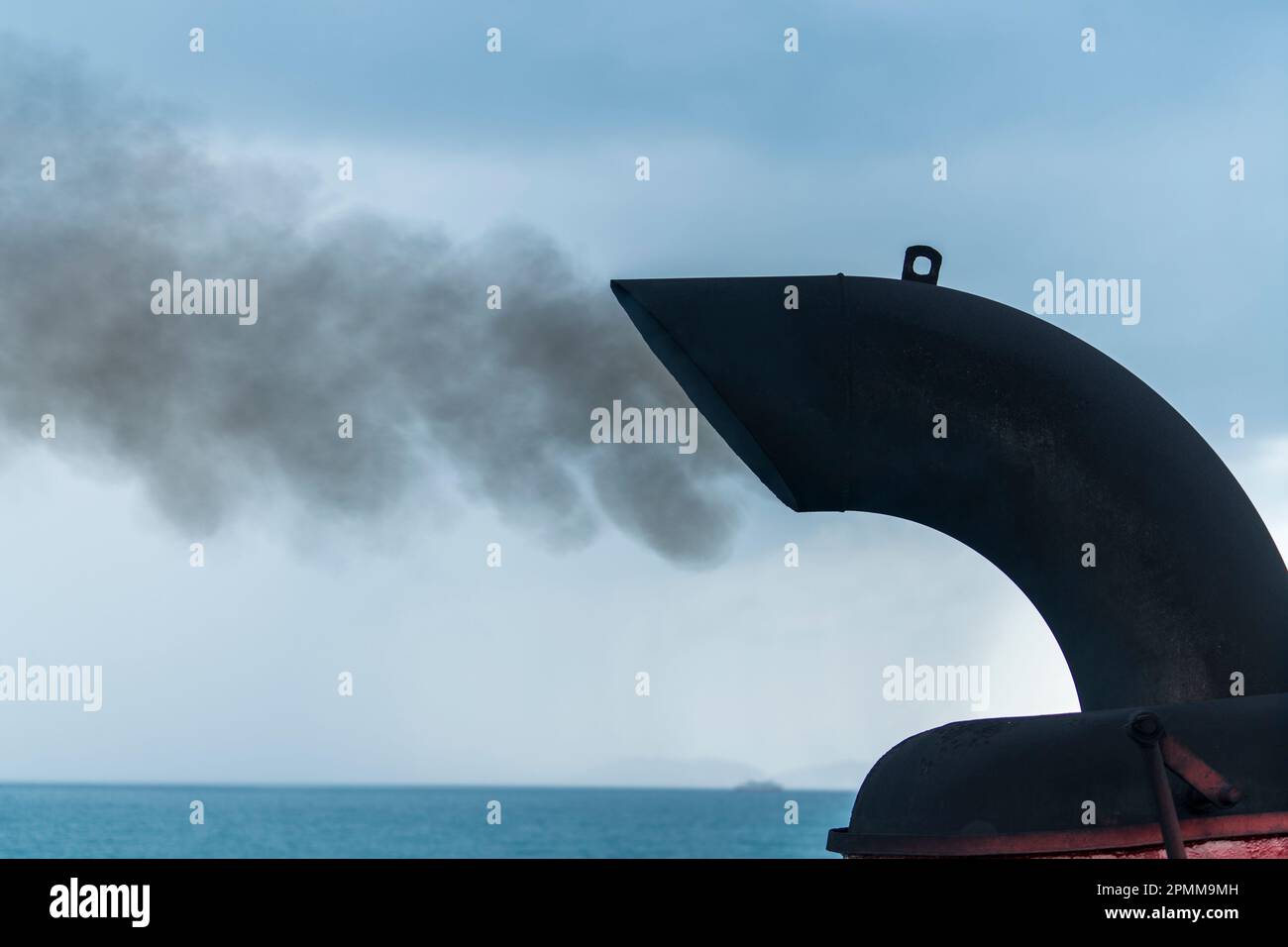 Smoke from ferry boat flue in background, close up, Thailand. Chimney