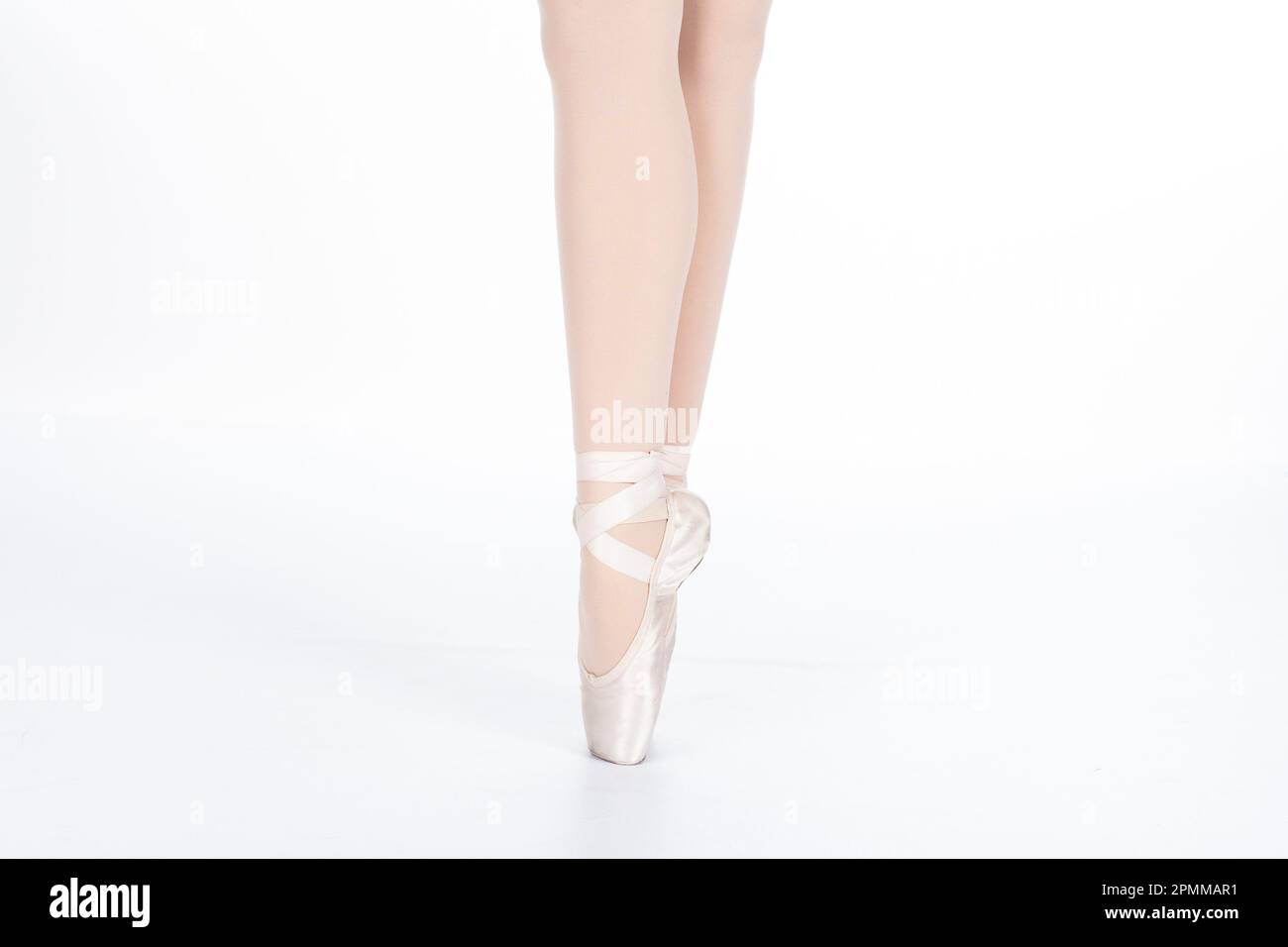 En Pointe CORRECT together closeup Close up of young female ballet dancer showing various classic ballet feet positions for classical ballet or dance Stock Photo