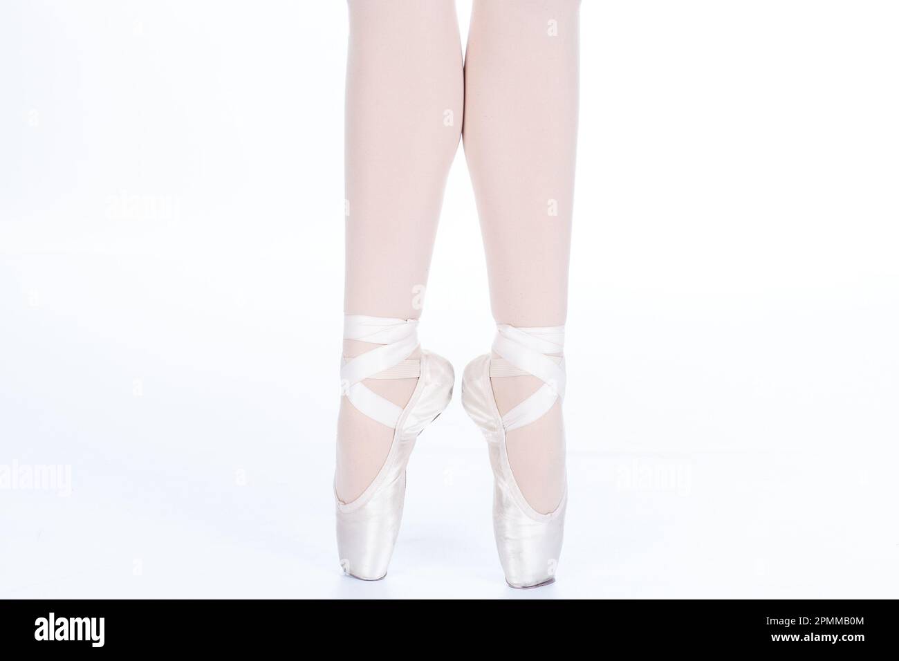 En Pointe CORRECT showing calves front on teachers perspective Close up of young female ballet