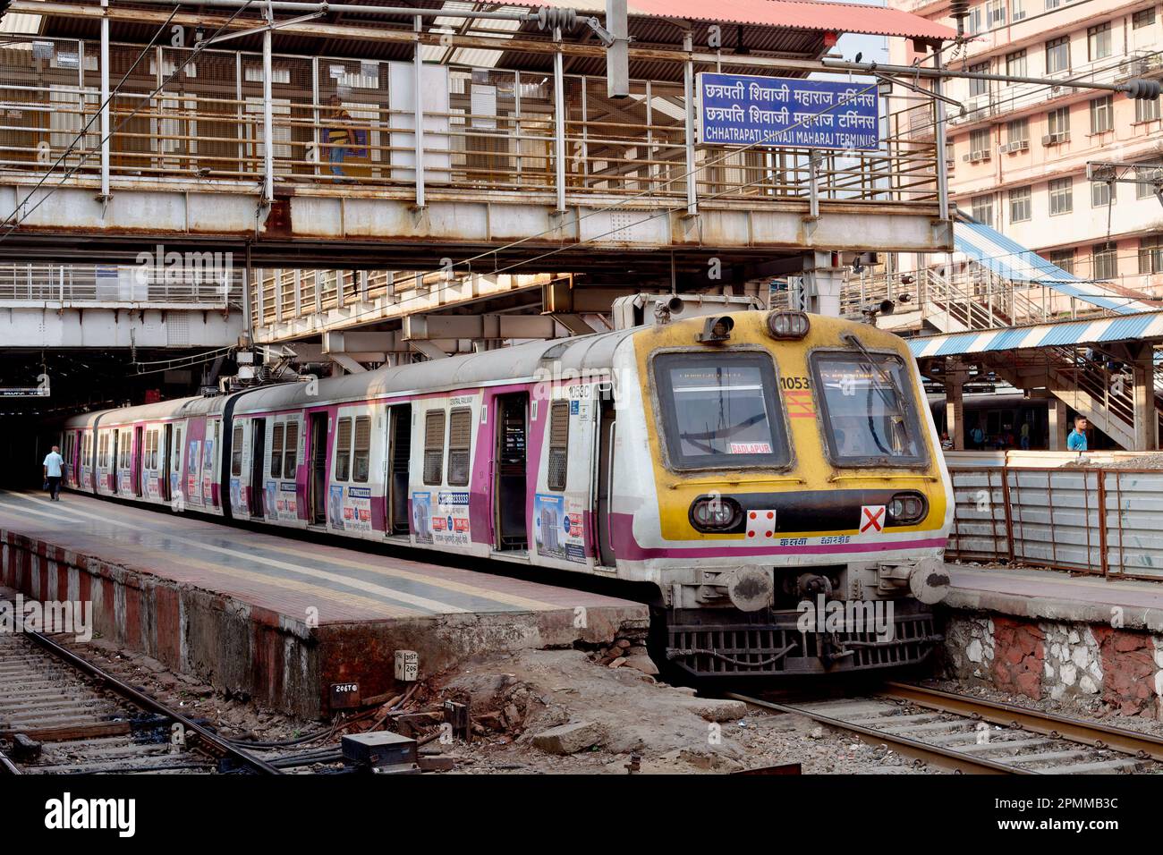 A local (suburban) train of the Central Railways line halted at Chhatrapati Shivaji Maharaj Terminus (CSMT) in Mumbai, India Stock Photo
