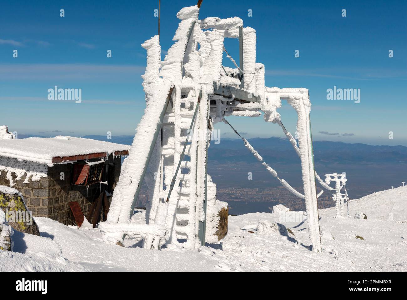 Ski lift station and wires covered in snow off season at the Black Peak