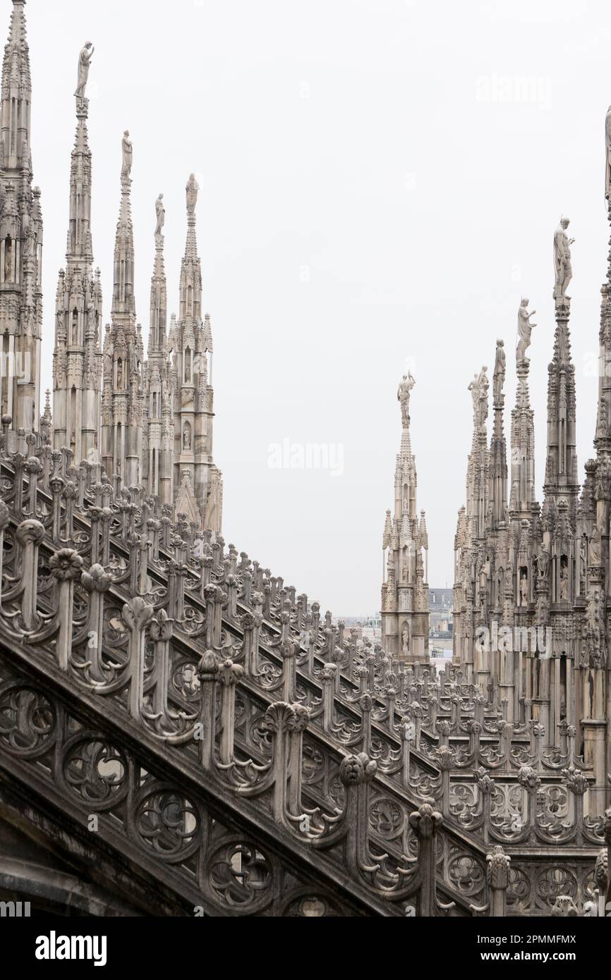 Stone spiers on the rooftop of the Duomo di Milano - MIlan, Lombardy, Italy. Stock Photo