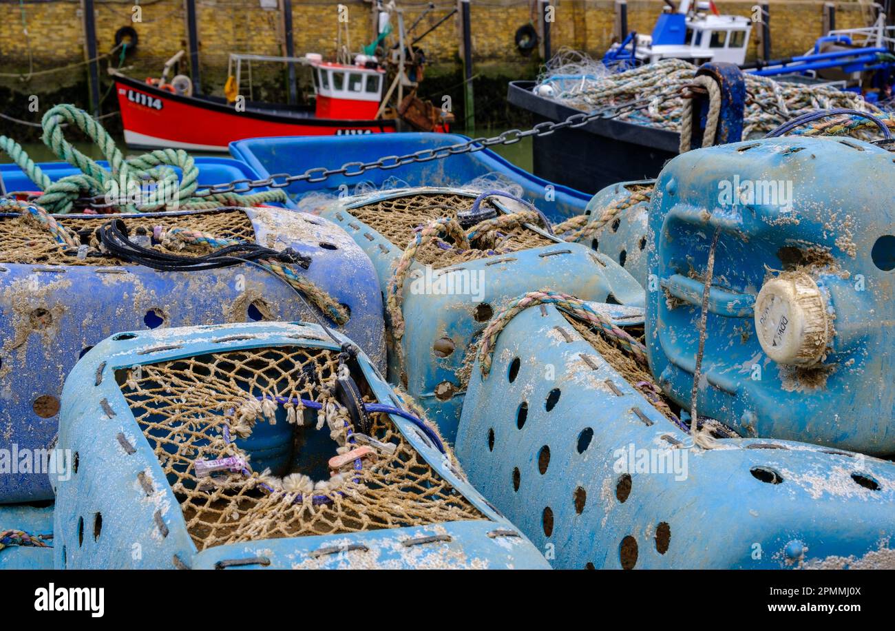 Detail of lobster pots made of blue plastic cannister with rope