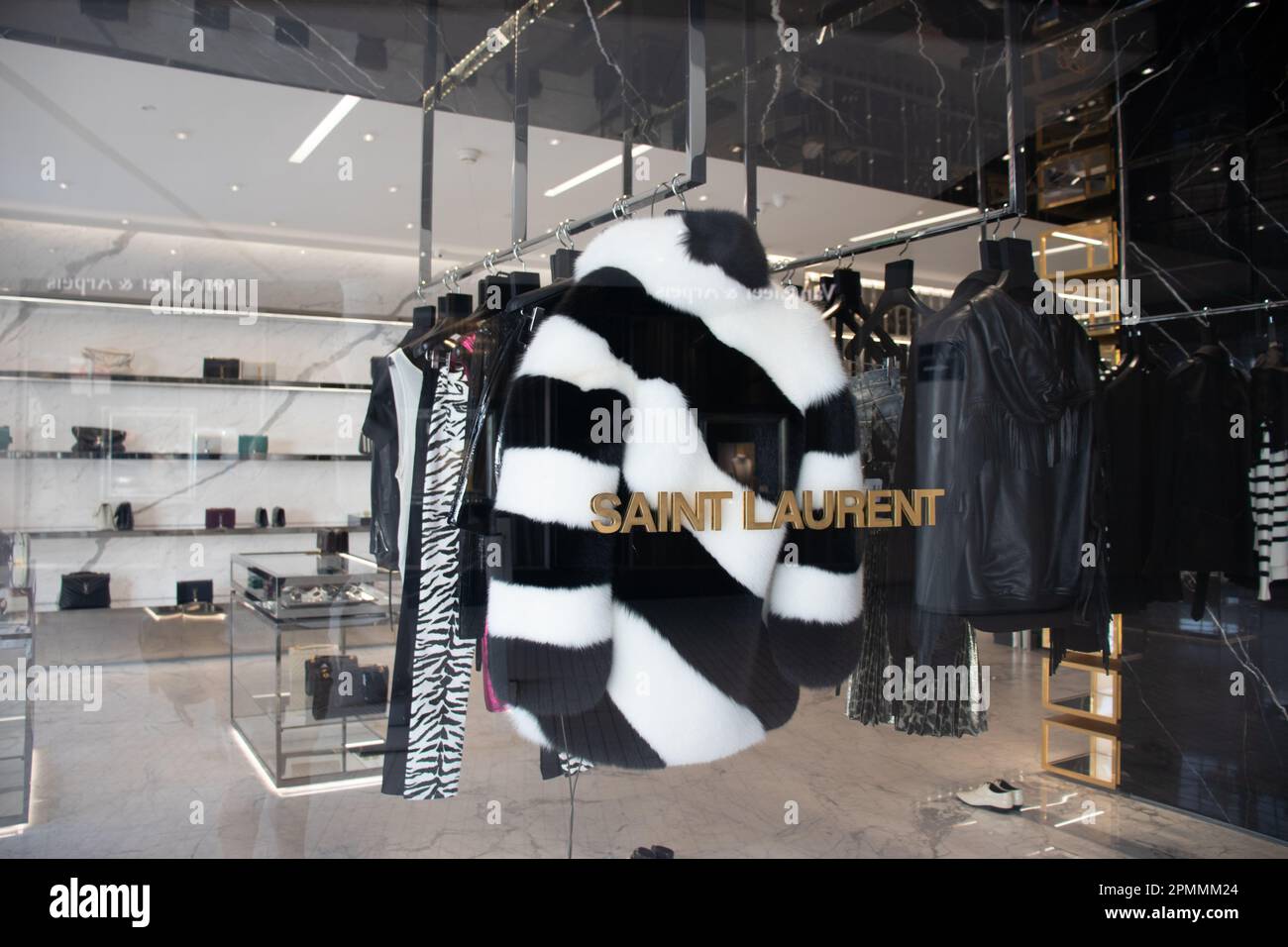 The luxury shop interior and window of the designer Yves Saint Laurent. Stock Photo