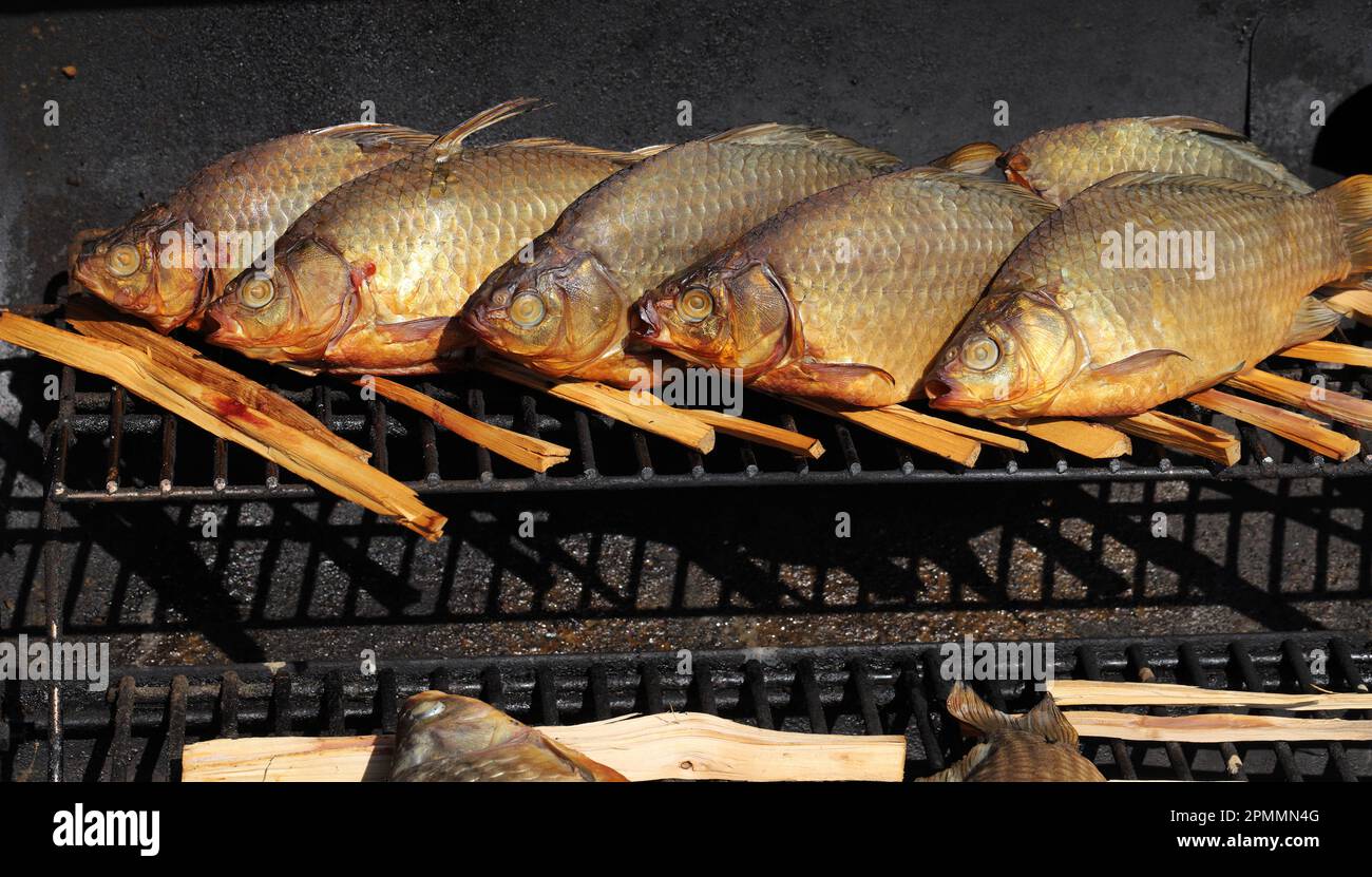 Smoked fish in a the mobile smoke hut Stock Photo Alamy