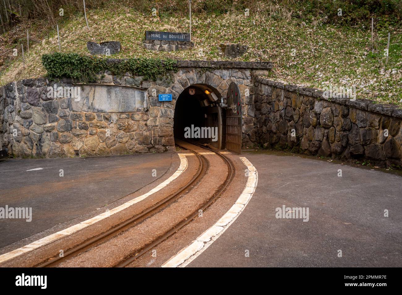 Bex, Vaud Canton, Switzerland - 8 April 2023: Rails and entrance to Bex salt mine tunnel. Stock Photo