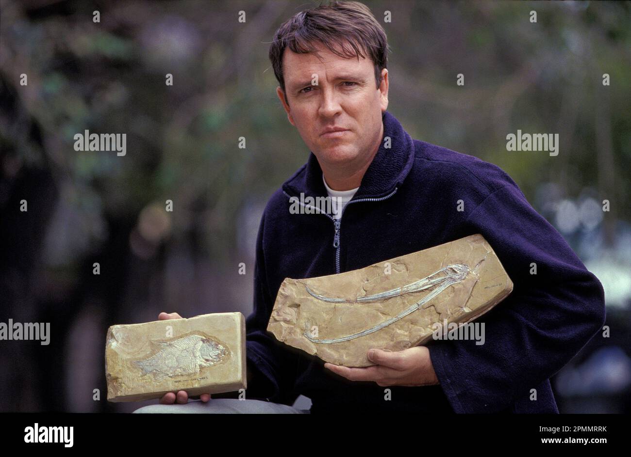 Argentina, San Luis. Palaeontologist showing fossils in National Park Sierras de las Quijadas. Stock Photo