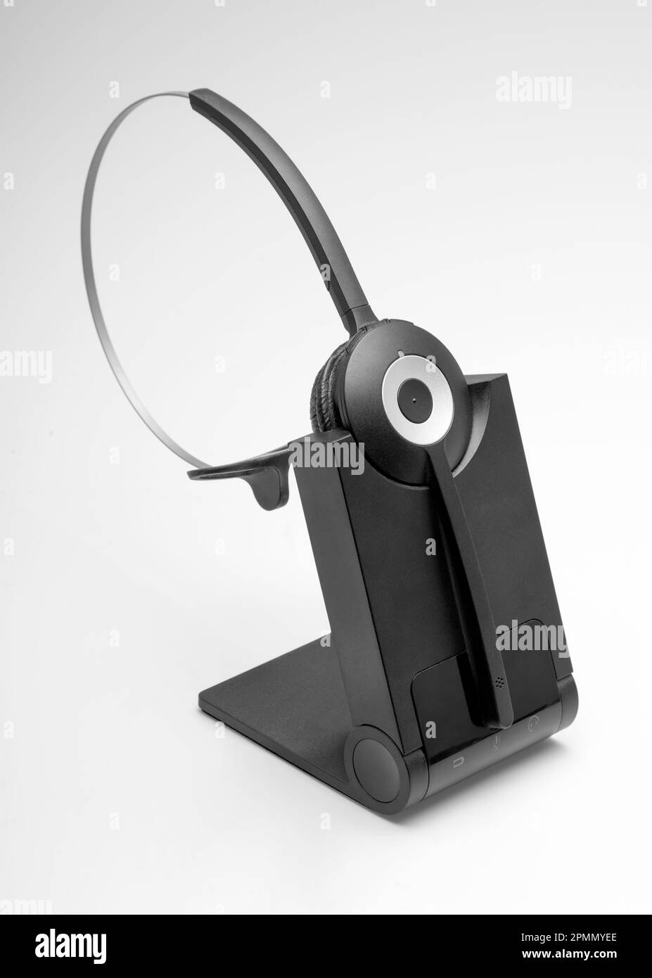 Studio shot of a black telephone headset in light ambiance Stock Photo
