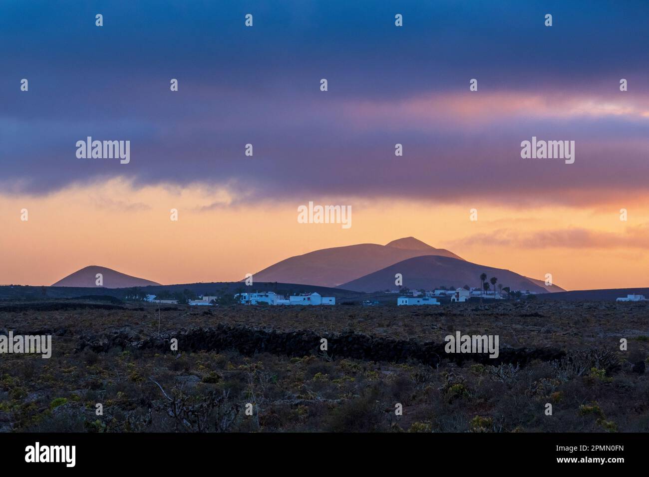Lanzarote, Canary Islands, Spain -- small rural town, mountains at sunset Stock Photo