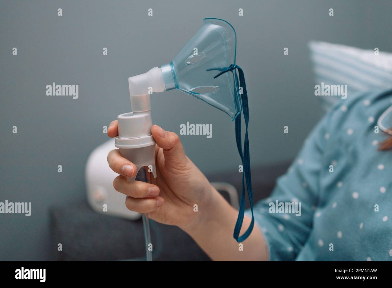 Young sick woman putting on nebulizer mask on face to make inhalation,  using an inhaler at home. Medical inhaler emergency equipment, asthmatic  attack Stock Photo - Alamy