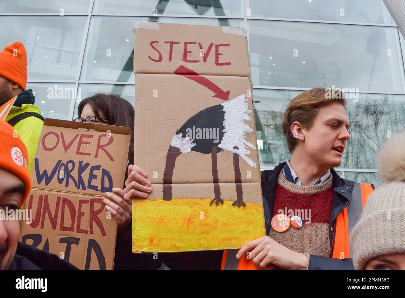 London, England, UK. 14th Apr, 2023. A junior doctor holds a sign depicting Health Secretary Steve Barclay as an ostrich with his head buried in the sand at the British Medical Association (BMA) picket outside University College Hospital on the final day of their four-day strike over pay restoration. (Credit Image: © Vuk Valcic/ZUMA Press Wire) EDITORIAL USAGE ONLY! Not for Commercial USAGE! Stock Photo