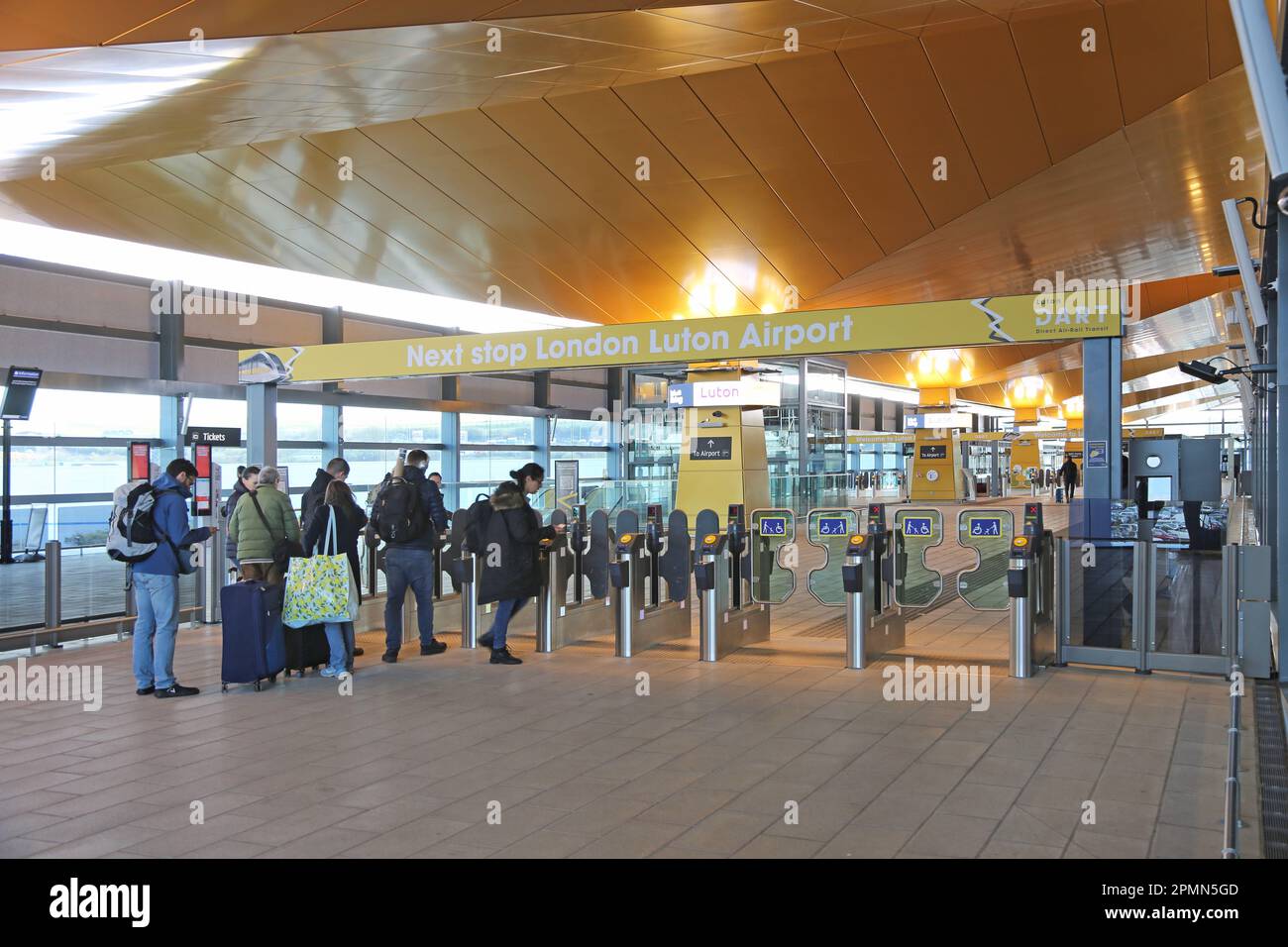 Passengers approach the new Luton Airport DART passenger transit system ...