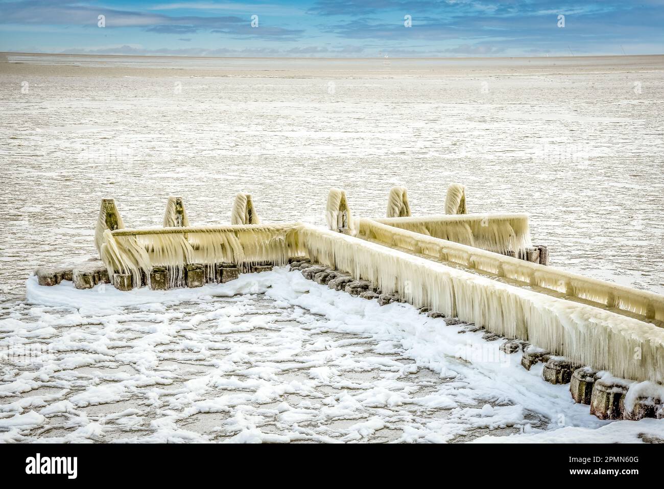 Den Oever, the Netherlands - February 10, 2021. Ice build-up on the piers of the Afsluitdijk in the IJsselmeer, Den Oever, Holland. Stock Photo