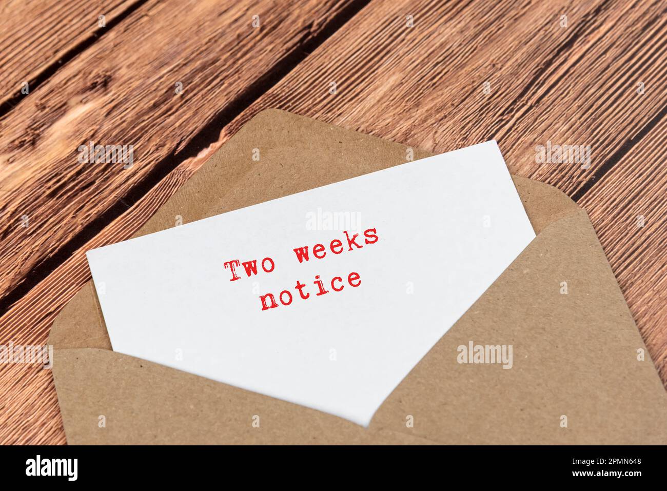 Letter in an envelope with text two weeks notice stock photo alamy