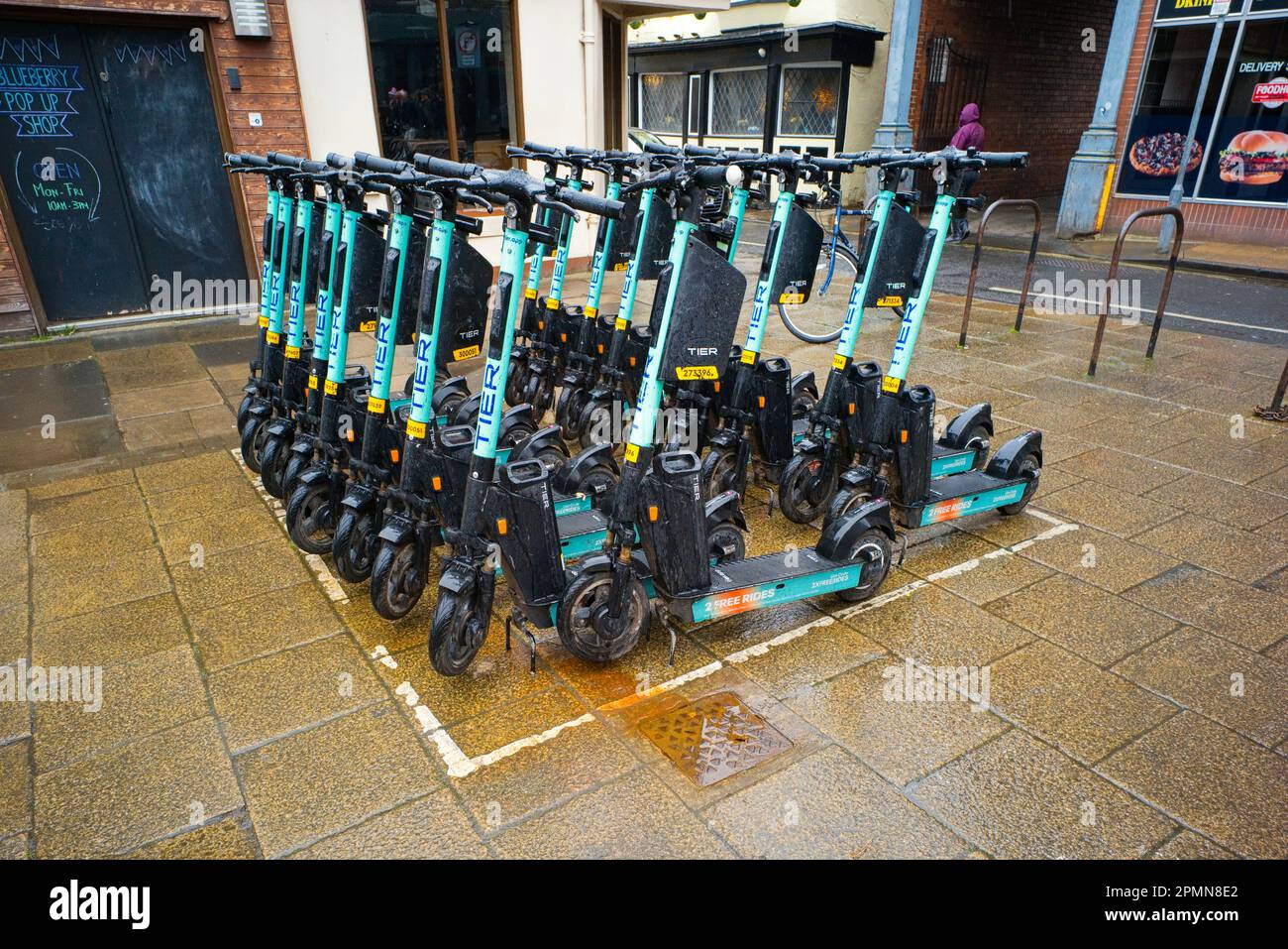 Tier electric scooters at a base station in the centre of York city Stock Photo